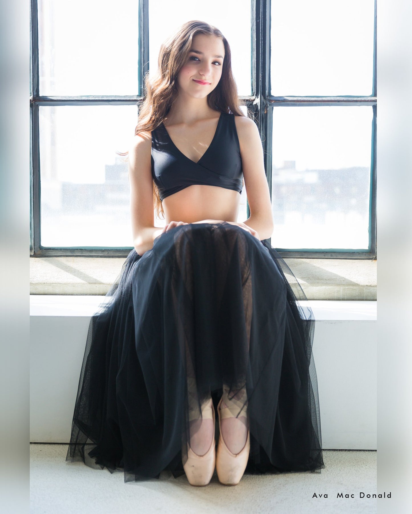 Black romantic ballet tutu skirt for ballerina. Dancer Ava wears professional dancewear from Callisto balletwear