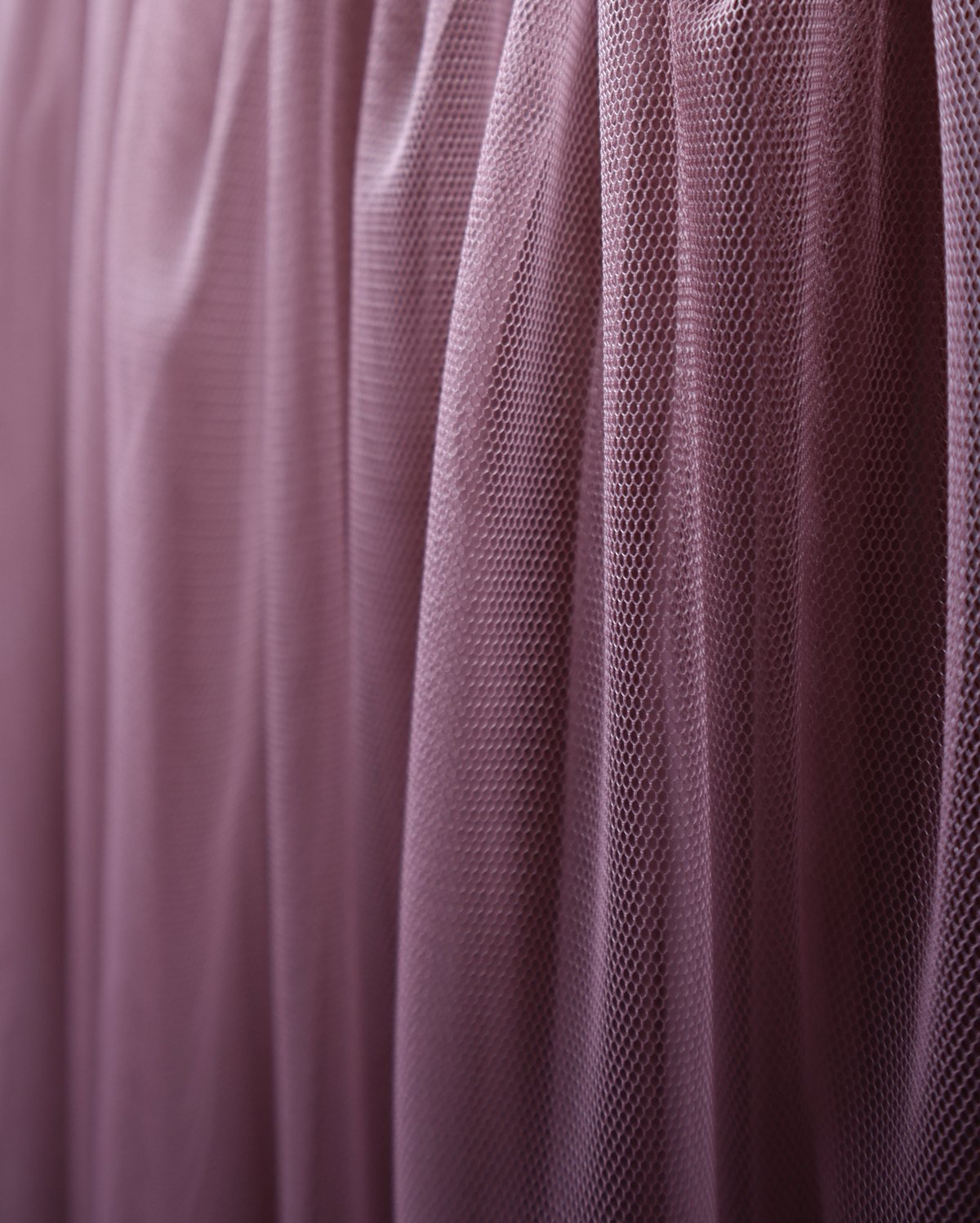 Close-up tutu tulle fabric color old rose. Handmade dancewear