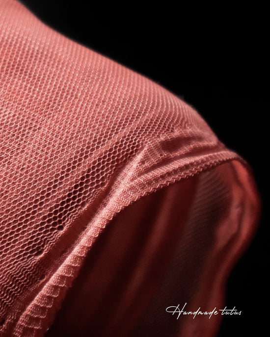 Tulle fabric colour rust, close-up. Tulle skirts for dancers